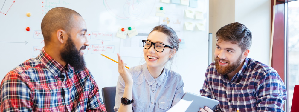 Multiethnic group of happy business people working together in office